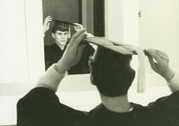 Graduating Student With Cap in Mirror